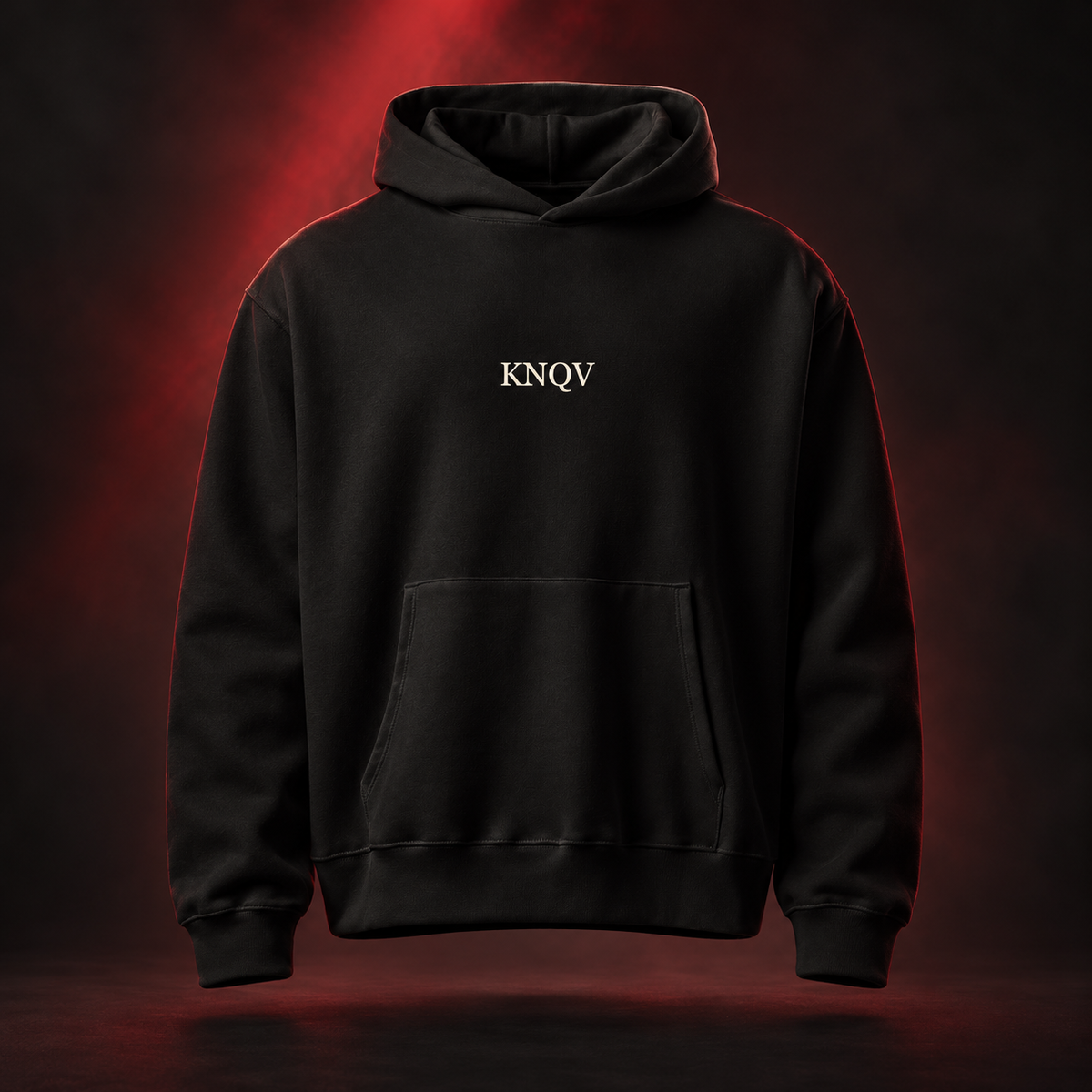 KNQV Music Capsule hoodie — AI-generated red-studio front mockup