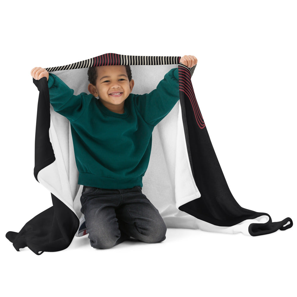 KNQV Frequency Throw Blanket shown with a male child model; digital supplier mockup